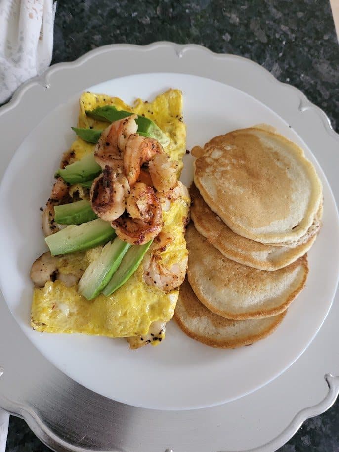 Pancakes with scrambled eggs and vegetables