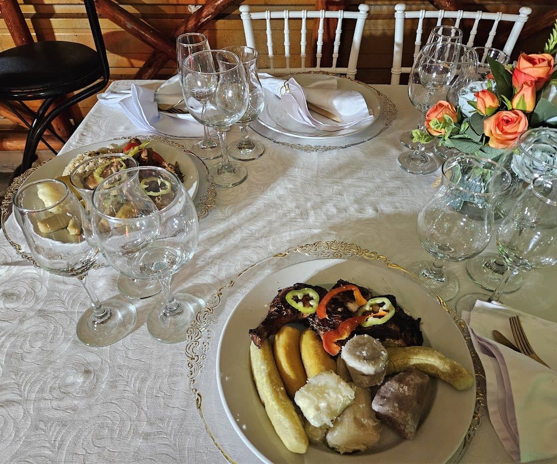 An elegant table set with wine glasses and flowers for a catered event